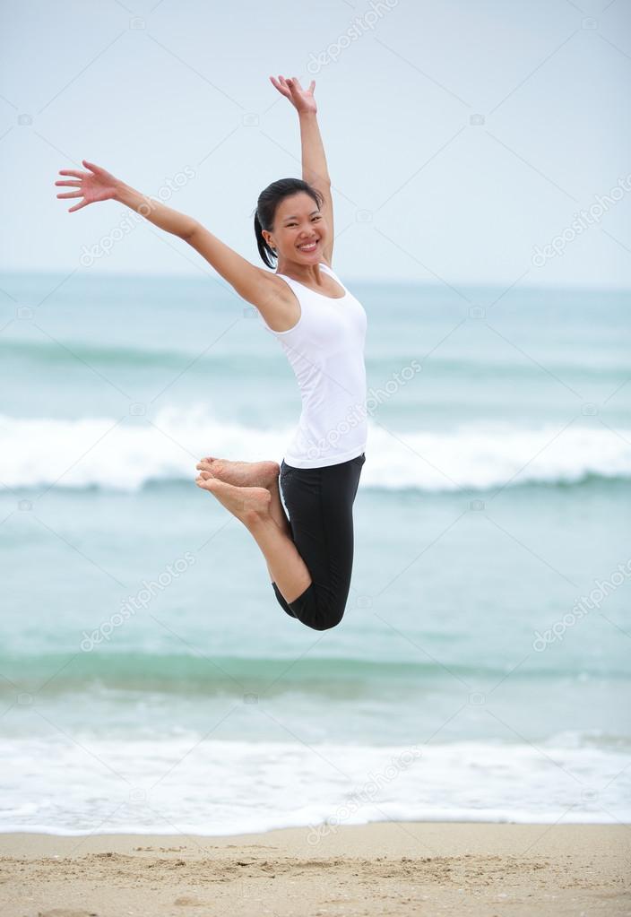 Woman jumping seaside