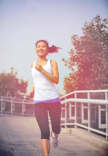 Woman running on wooden trail seaside — Stock Photo, Image