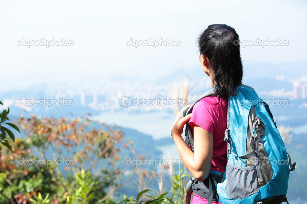 Woman enjoy view at mountain peak