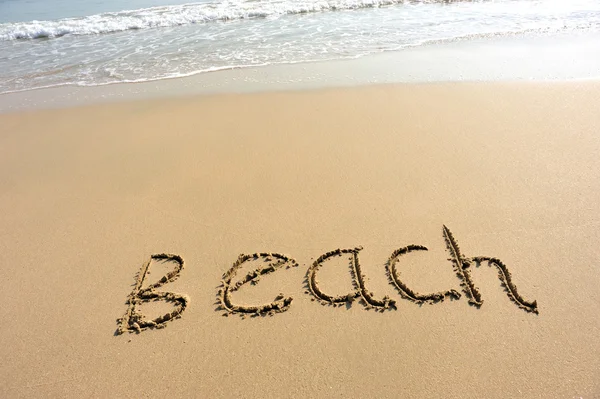 Strandwort auf Sand gezeichnet — Stockfoto