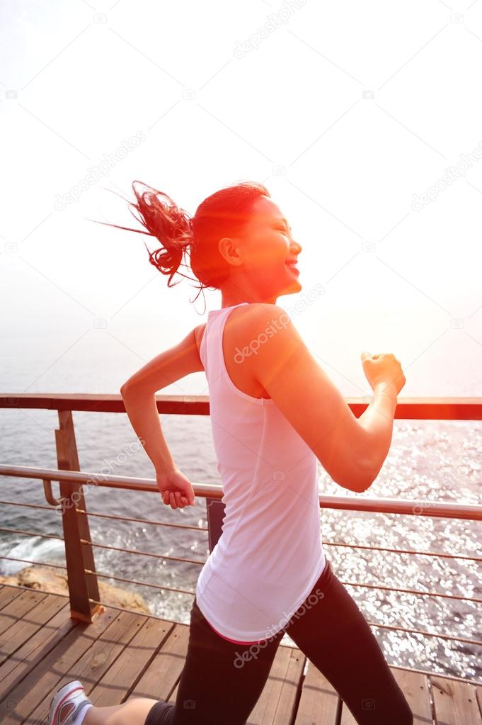 Happy asian woman running