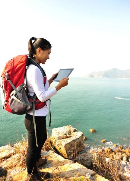 Hiking woman stand use digital tablet — Stock Photo, Image