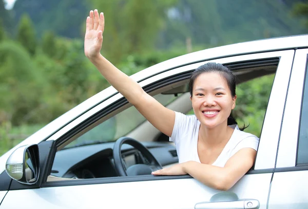 Driver in the car give salute gesture — Stock Photo, Image