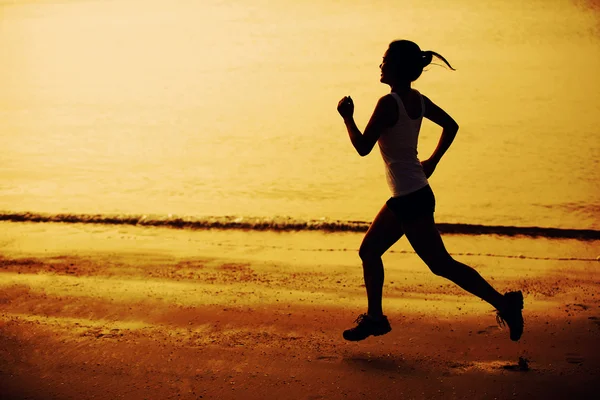 Fitness woman jogging at sunrise — Stock Photo, Image