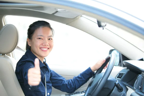 Driver thumb up in car — Stock Photo, Image