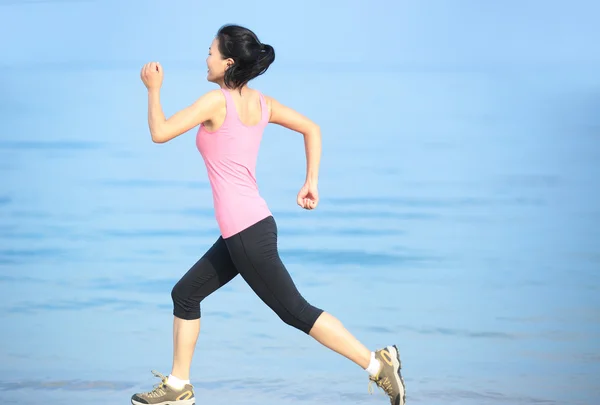 Asian woman running on beach — Stock Photo, Image