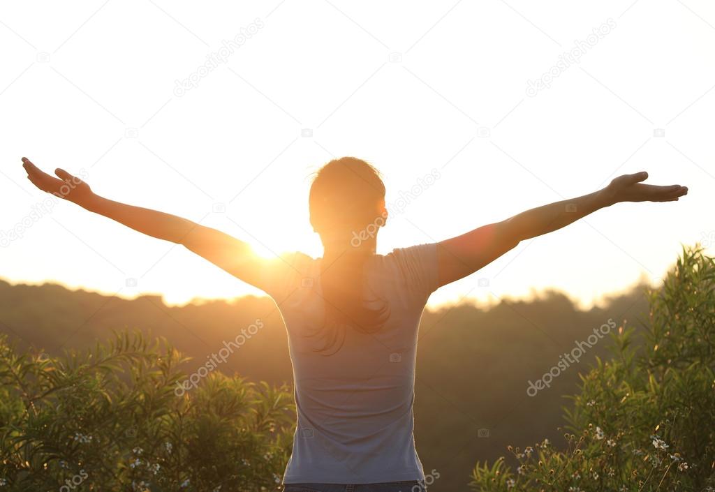 Thankful woman open arms