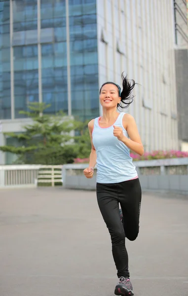 Asian woman running in the  city — Stock Photo, Image