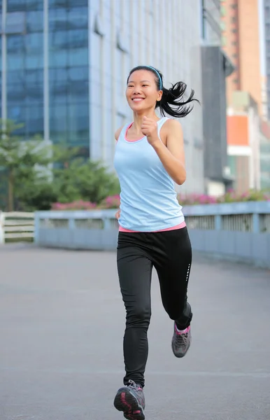 Asian woman running in the  city — Stock Photo, Image