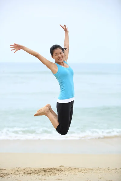 Woman jumping seaside — Stock Photo, Image