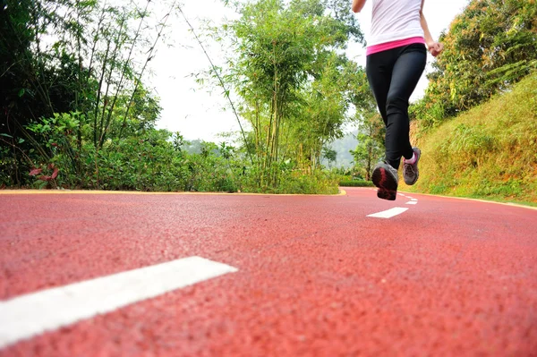 Woman running at park — Stock Photo, Image