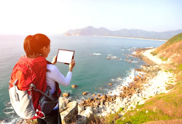 Hiking woman use digital tablet — Stock Photo, Image