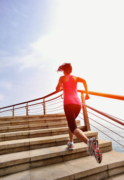 Runner athlete running at seaside.