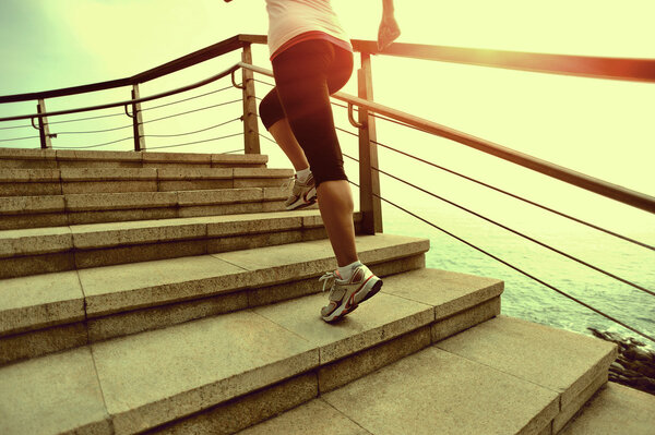 Runner athlete running at seaside.