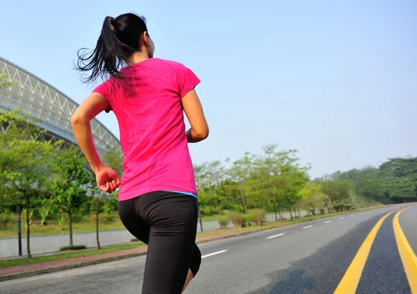 Woman running at city street — Stock Photo, Image