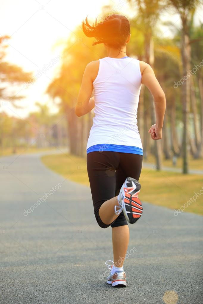 Runner athlete running at tropical park road