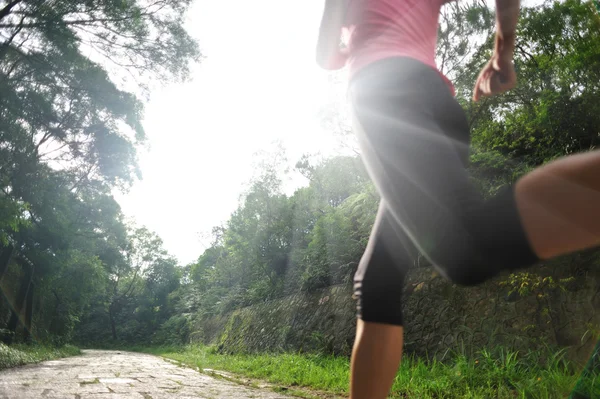 Runner athlete running on sunrise road — Stock Photo, Image