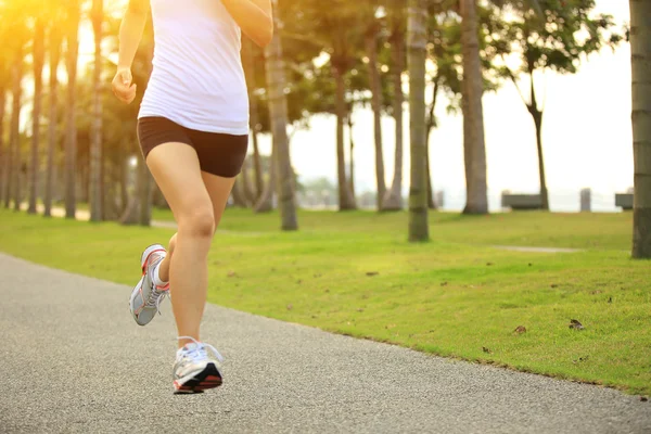 Runner athlete running at tropical park — Stock Photo, Image