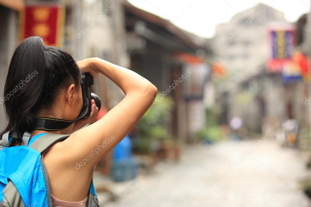 Woman photographer taking photo