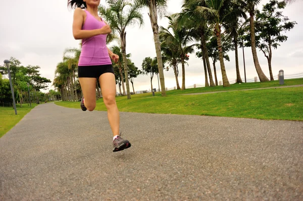 Runner athlete running at tropical park. — Stock Photo, Image