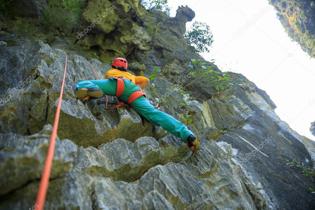 Female rock climber on cliff