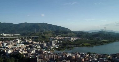 drone view of the modern asian city with lake