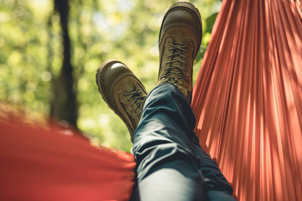 Relaxing in hammock in tropical forest