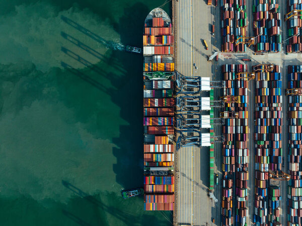 Aerial view of ship docking at container terminal 