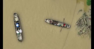 Aerial view of ships on the dirty water