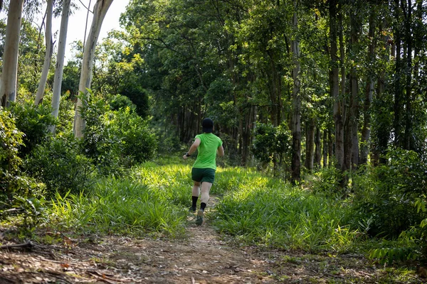 Woman Trail Runner Running Tropical Forest Mountain Peak — Stock Fotó