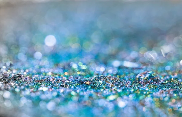 Vatten Droppe Blått Glitter Suddig Bakgrund Med Glänsande Bokeh — Stockfoto