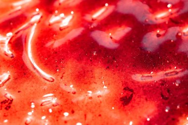 Kırmızı, soyut, ıslak, parlak desenli arka plan.