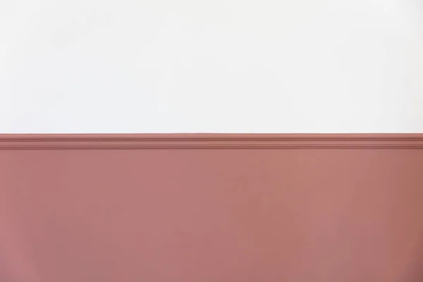 Modern interior with a painted victorian dado rail in pink and blank white wall above — Stock Photo, Image