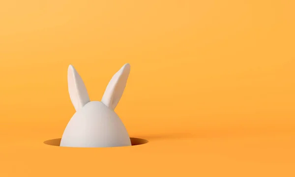 Пасхальное кроличье яйцо. Пасхальное яйцо с кроличьими ушами на ярко-желтом фоне. 3D рендеринг — стоковое фото