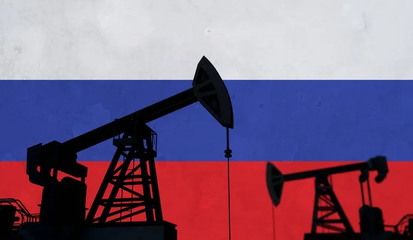 Oil and gas industry background. Oil pump silhouette against a russian flag. 3D Rendering — стокове фото