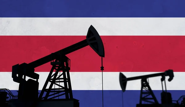 Oil and gas industry background. Oil pump silhouette against costa rica flag. 3D Rendering — Foto de Stock