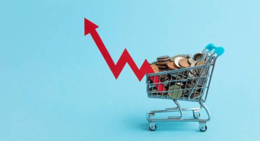 Shopping trolly full of coins and a red inflation arrow.