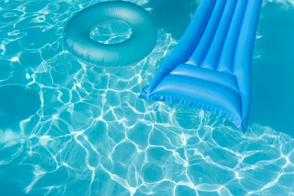 Bright Blue Summer Pool Lounger Float Rippled Swimming Pool — стоковое фото