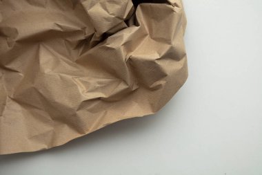 crumpled brown kraft paper background. Recycle old brown paper texture.