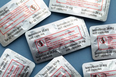 LONDON, UK - August 2022: packs of isotretinoin or roaccutane tablets used to treat severe acne.