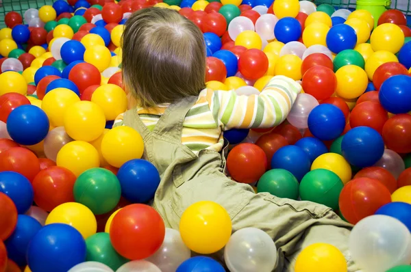 Baby girl in ball pit