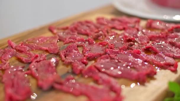 Close Chef Hands Adding Olive Oil Carpaccio Meat Wooden Kitchen — Stock Video