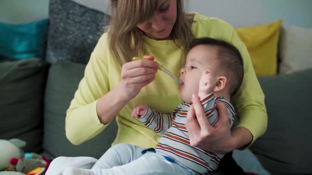 Mother Feeding Porridge Baby Silicone Spoon — Stock Video