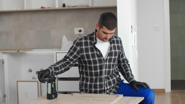 Carpenter Screwing Mounting Hinge Front Panel Kitchen Shelves — Stock Video