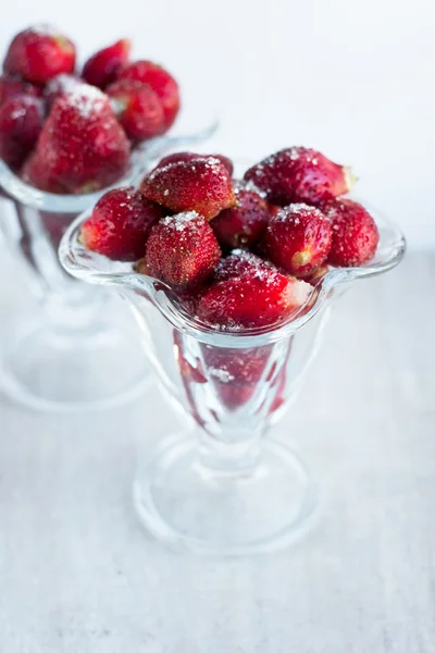 Sweet juicy strawberry with sugar in the glass beaker — Stock Photo, Image