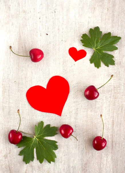 Red sweet cherry and hearts — Stock Photo, Image