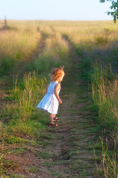 Small child in the light dress — Stock Photo, Image