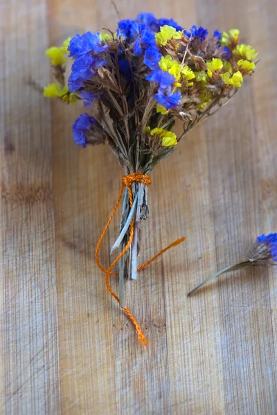 Bouquet of dried flowers on the striped board — Stock Photo, Image