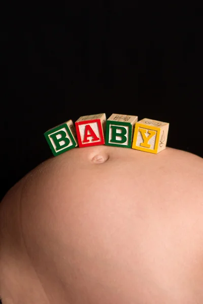 Houten spelen blokken spelling van het woord-baby — Stockfoto