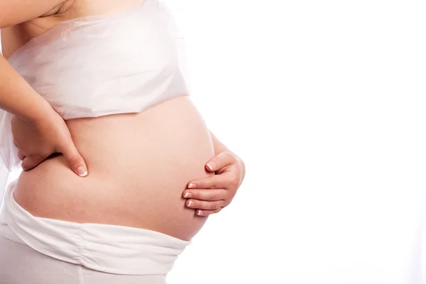 Zwangere vrouw houdt van haar pijnlijke rug — Stockfoto